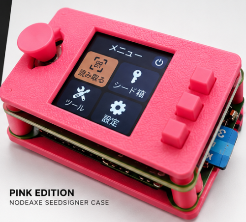 SeedSigner in a pink NodeAxe open-frame case with joystick and three buttons.